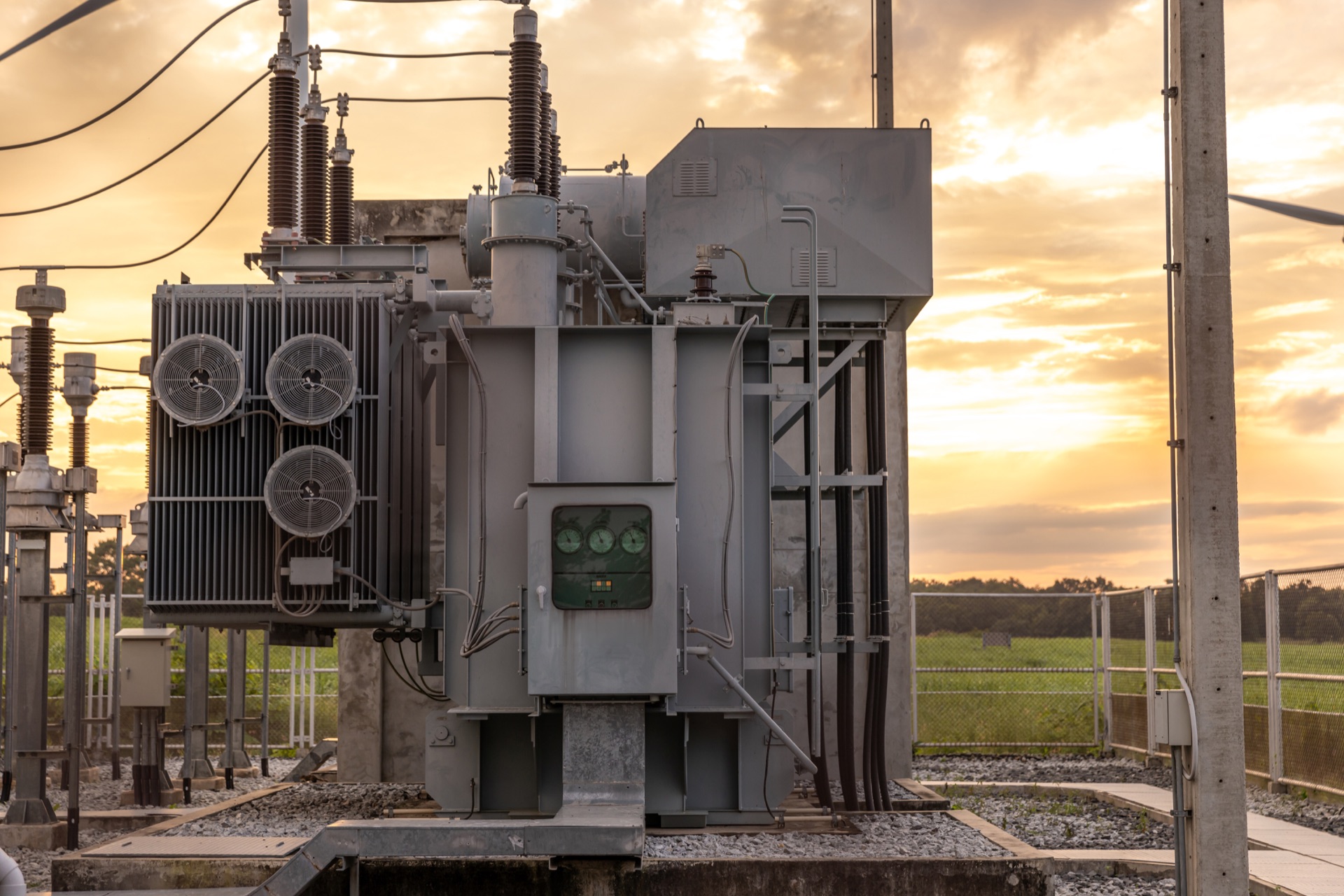Electrical transformer substation at dusk - power infrastructure and equipment supply